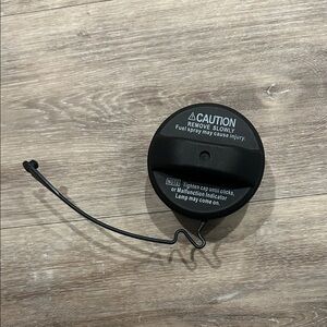 Black Fuel Cap with Warning Text